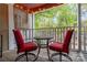 Outdoor balcony with seating and a view of the surrounding greenery at 2502 Cranbrook Ln # 4, Charlotte, NC 28207