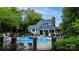 Community clubhouse, pool and hot tub surrounded by lush landscaping and lounge chairs for relaxation and enjoyment at 2502 Cranbrook Ln # 4, Charlotte, NC 28207