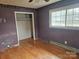 Bedroom with wood floors, window, and closet at 2518 Cove Creek Dr, Gastonia, NC 28056