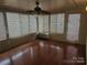 Sunroom with wood floors, multiple windows, and AC unit at 2518 Cove Creek Dr, Gastonia, NC 28056