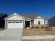 New construction home with two-car garage and landscaping at 2526 Crimson Way, Monroe, NC 28112