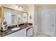 Bathroom with a large vanity, granite countertop, and walk-in closet at 2706 White Pines Ct, Monroe, NC 28112