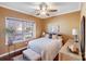 Bedroom with double windows, neutral decor, and a ceiling fan at 2706 White Pines Ct, Monroe, NC 28112