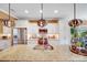 Granite countertop kitchen island with stainless steel appliances and white cabinets at 2706 White Pines Ct, Monroe, NC 28112