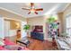 Spacious living room with a red couch and built-in shelving at 2706 White Pines Ct, Monroe, NC 28112