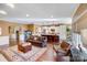 Open living room featuring hardwood floors, a cozy sofa, and access to the kitchen at 2706 White Pines Ct, Monroe, NC 28112