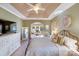 Main bedroom with tray ceiling, sitting area, and walk-in closet at 2706 White Pines Ct, Monroe, NC 28112