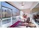 Relaxing screened porch with seating area and ceiling fan at 2706 White Pines Ct, Monroe, NC 28112