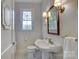 Charming bathroom with pedestal sink and window at 2912 Park Rd, Charlotte, NC 28209