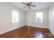 Bright bedroom with hardwood floors and two windows at 2912 Park Rd, Charlotte, NC 28209