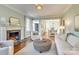 Spacious living room featuring a fireplace and ample natural light at 2912 Park Rd, Charlotte, NC 28209