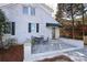 Private brick patio with bistro set adjacent to home at 2912 Park Rd, Charlotte, NC 28209