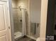 Clean bathroom with shower stall and gray tile at 306 Union St, Maiden, NC 28650