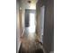 Bright hallway with wood-look floors and access to multiple rooms at 306 Union St, Maiden, NC 28650