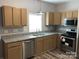 Modern kitchen with stainless steel appliances and granite countertops at 306 Union St, Maiden, NC 28650