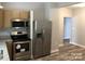 Stainless steel appliances and granite countertops in a modern kitchen at 306 Union St, Maiden, NC 28650