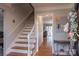 Bright entryway with staircase, hardwood floors, and a half-bath at 3165 Wimbledon Ln, Rock Hill, SC 29732