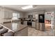 L-shaped kitchen with stainless steel appliances and light gray cabinets at 3165 Wimbledon Ln, Rock Hill, SC 29732