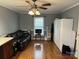 Home office with hardwood floors, a ceiling fan, and built-in storage at 3165 Wimbledon Ln, Rock Hill, SC 29732