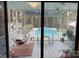 Screened porch overlooking the pool and backyard, with a swing and seating area at 3165 Wimbledon Ln, Rock Hill, SC 29732