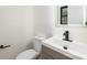 Clean bathroom with modern vanity and toilet at 3801 Woodleaf Rd, Charlotte, NC 28205