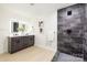 Modern bathroom with double vanity, walk-in shower, and dark tile at 3801 Woodleaf Rd, Charlotte, NC 28205