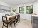 Elegant dining room with a wood table and six chairs, near the kitchen at 3801 Woodleaf Rd, Charlotte, NC 28205