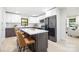 Modern kitchen with two-toned cabinetry, quartz countertops, and island at 3801 Woodleaf Rd, Charlotte, NC 28205