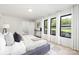 Main bedroom featuring a comfortable bed and large windows at 3801 Woodleaf Rd, Charlotte, NC 28205