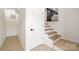 Modern staircase leading to the lower level at 3801 Woodleaf Rd, Charlotte, NC 28205