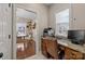 Home office with granite countertop desk, window with blinds, and view to dining area at 4119 Flint Dr, Lancaster, SC 29720