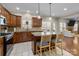 Kitchen boasts granite countertops, wood cabinets, and a center island with seating at 4119 Flint Dr, Lancaster, SC 29720