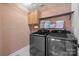 Laundry room with washer, dryer, and shelves at 4119 Flint Dr, Lancaster, SC 29720