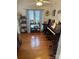 Home office with hardwood floors, built-in shelving, and large window at 4305 Chatterleigh Dr, Monroe, NC 28110