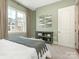 Bedroom with neutral walls and large window at 4620 Piedmont Row Dr # 608, Charlotte, NC 28210