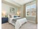 Bright bedroom with large window and neutral decor at 4620 Piedmont Row Dr # 608, Charlotte, NC 28210