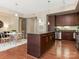 Island kitchen with granite countertops and hardwood floors at 4620 Piedmont Row Dr # 608, Charlotte, NC 28210