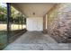 Covered back porch with storage room and brick wall at 4804 Chapel Grove Rd, Gastonia, NC 28052