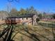 Backyard view of the home, showing a deck and fenced yard at 4804 Chapel Grove Rd, Gastonia, NC 28052