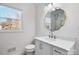 Bathroom with white vanity, large mirror, and marble accents at 4804 Chapel Grove Rd, Gastonia, NC 28052