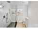 Modern bathroom with marble shower and white vanity at 4804 Chapel Grove Rd, Gastonia, NC 28052