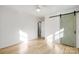 Bedroom with light wood floors and barn door at 4804 Chapel Grove Rd, Gastonia, NC 28052