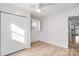 Bedroom with hardwood floors, closet, and view into kitchen at 4804 Chapel Grove Rd, Gastonia, NC 28052