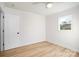 Light-filled bedroom, featuring hardwood floors and a closet at 4804 Chapel Grove Rd, Gastonia, NC 28052