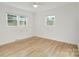 Bright bedroom with hardwood floors and large windows at 4804 Chapel Grove Rd, Gastonia, NC 28052