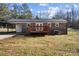 Ranch-style home with backyard, deck and carport at 4804 Chapel Grove Rd, Gastonia, NC 28052