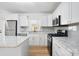 Updated kitchen with white cabinets and marble countertops at 4804 Chapel Grove Rd, Gastonia, NC 28052