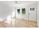 Light-filled living room featuring hardwood floors and a ceiling fan at 4804 Chapel Grove Rd, Gastonia, NC 28052