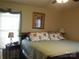 Primary bedroom with a king-size bed and floral bedding at 4819 Vander Ln # 54, Monroe, NC 28110