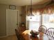 Kitchen dining area with wood table, chairs, and window seating at 4819 Vander Ln # 54, Monroe, NC 28110